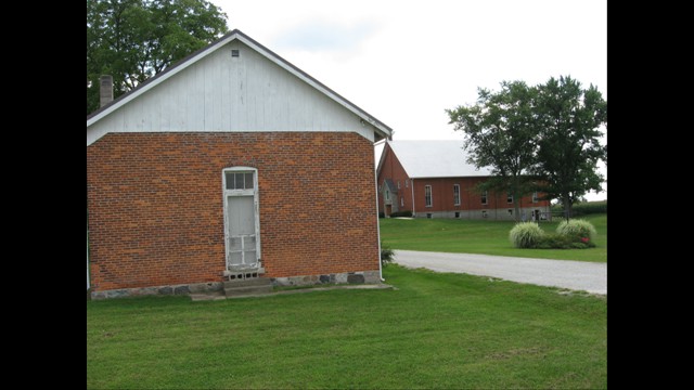 Acme School, with Church and Pleasant Hill Cemetery in Background